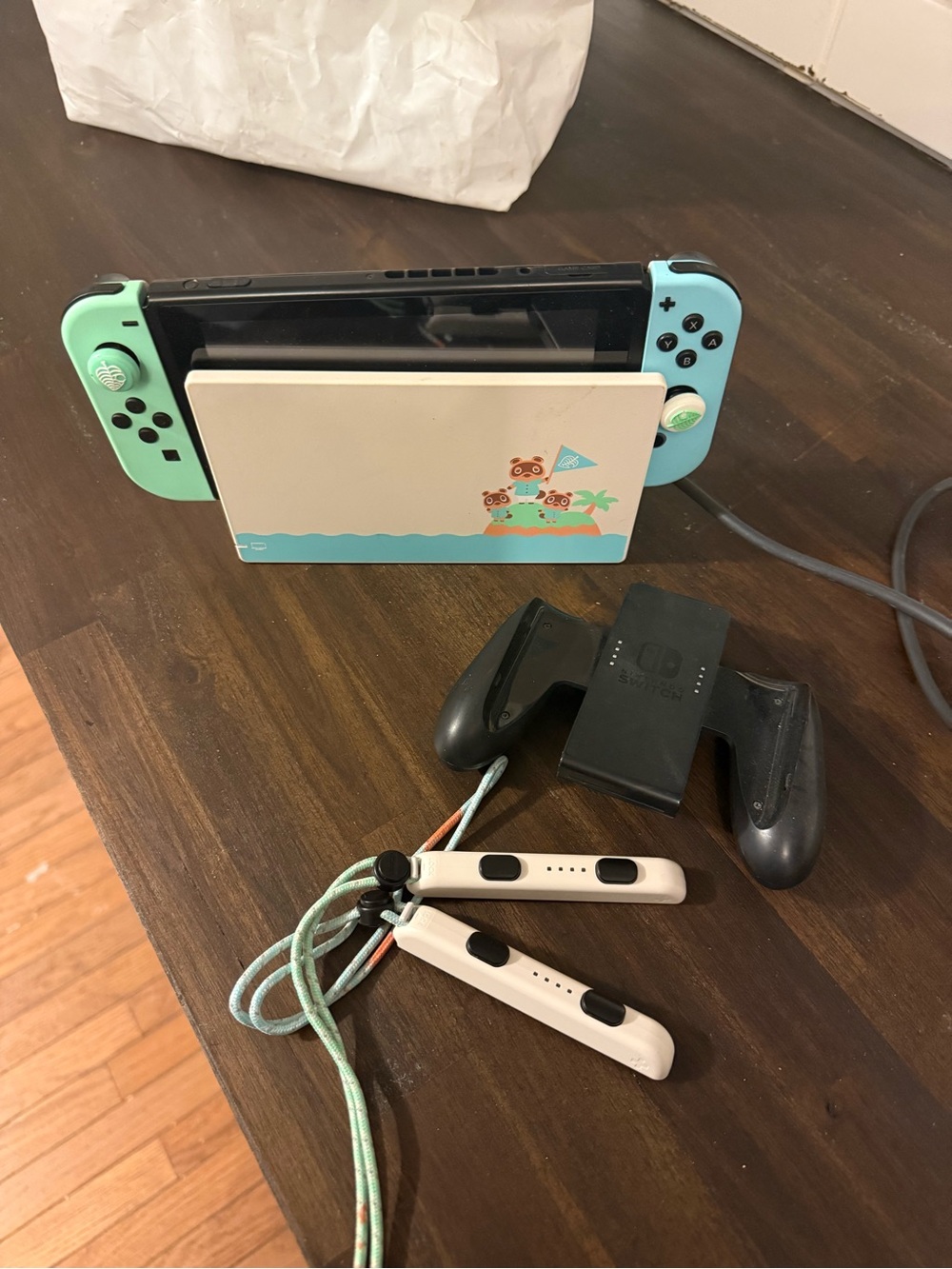 Nintendo Switch with Mint Green & Mint Blue Joy‑Con and Animal Crossing Dock